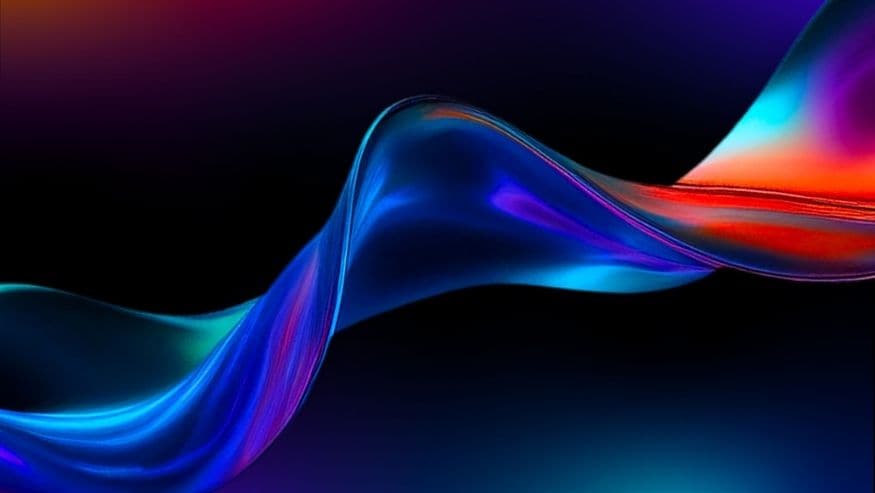 An abstract wave in vibrant blue and red on a dark gradient background.
