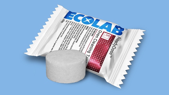 Ecolab ReadyDose Oven Rinse Tablet with packaging and a white cleaning tablet